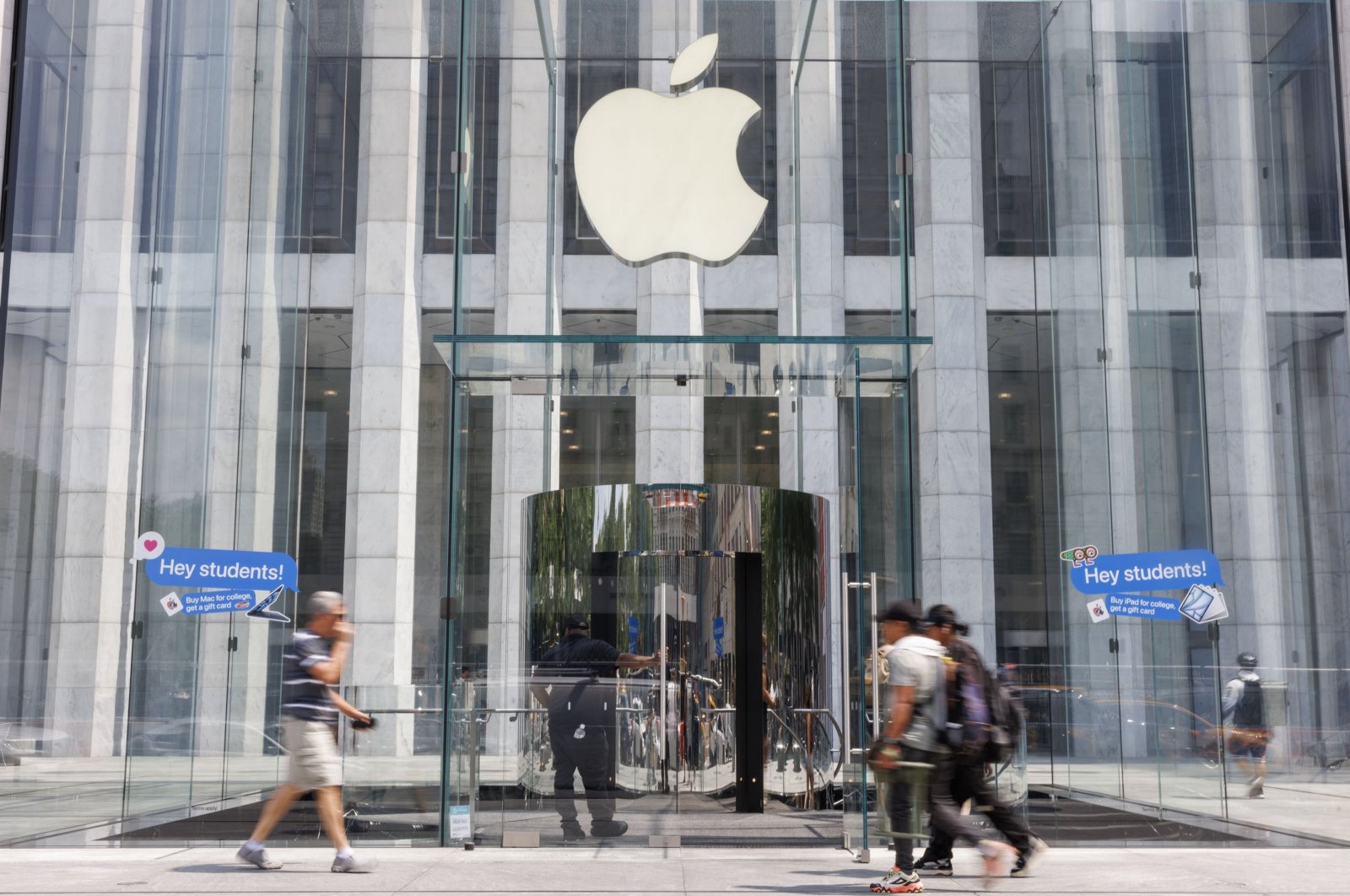 People walk into and past the Apple Store on Fifth Avenue in New York City, New York, U.S., Aug. 1, 2024. (EPA Photo)