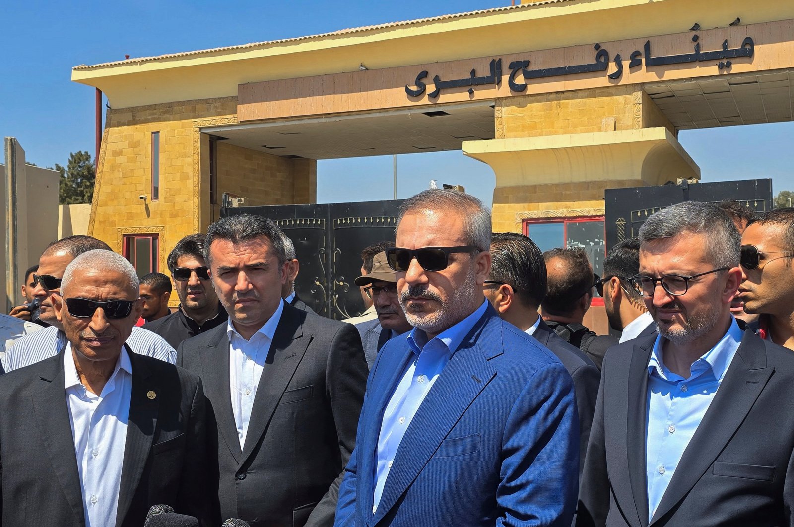 Foreign Minister Hakan Fidan (C) meets with Egypt&#039;s North Sinai Governor Khaled Megawer (L) as he arrives at the Rafah border crossing between Egypt and the Gaza Strip, Aug. 4, 2024. (Reuters Photo)