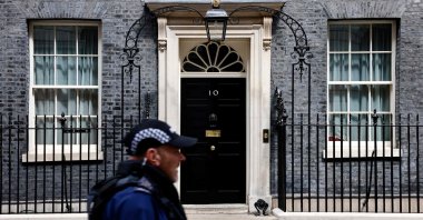 A police officer passes the door to 10 Downing Street in central London, U.K., Aug. 5, 2024. (AFP Photo)