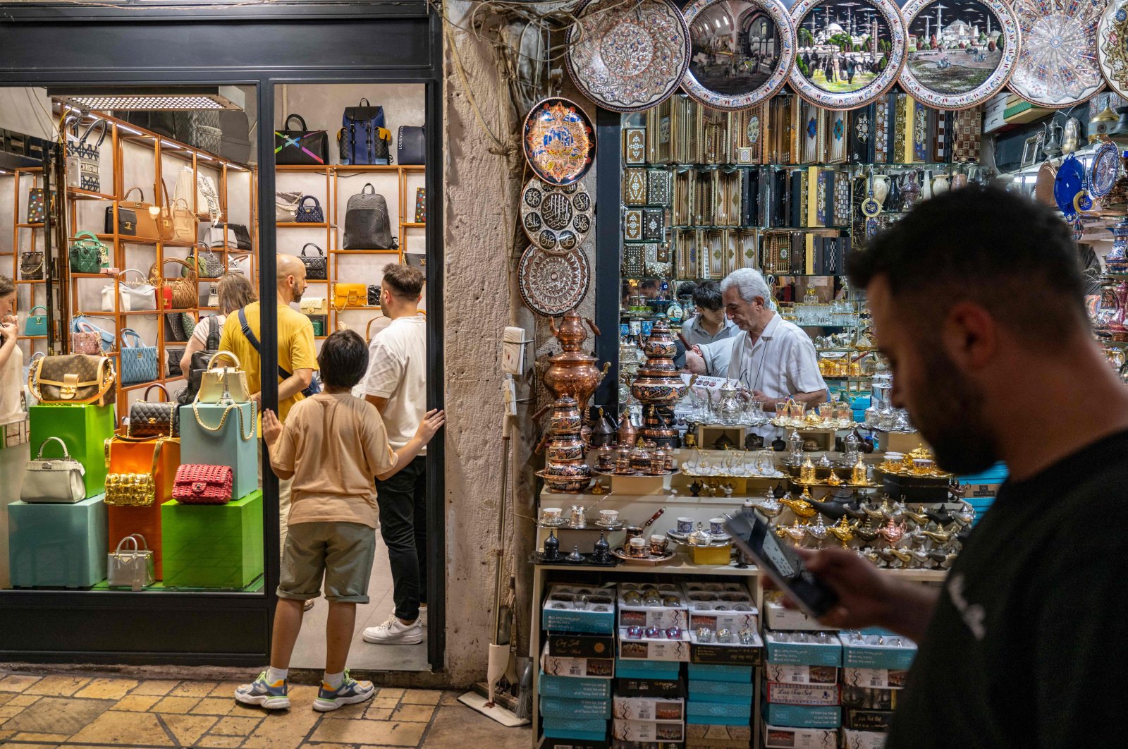 Visitors walk past a shop at the historical Grand Bazaar, Istanbul, Türkiye, July 9, 2024. (AFP Photo)