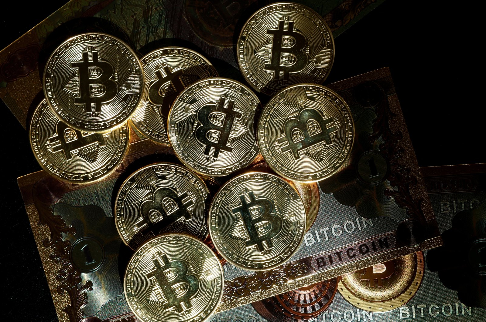 Representations of the cryptocurrency bitcoin are seen in this illustration picture taken in Paris, France, March 9, 2024. (Reuters Photo)