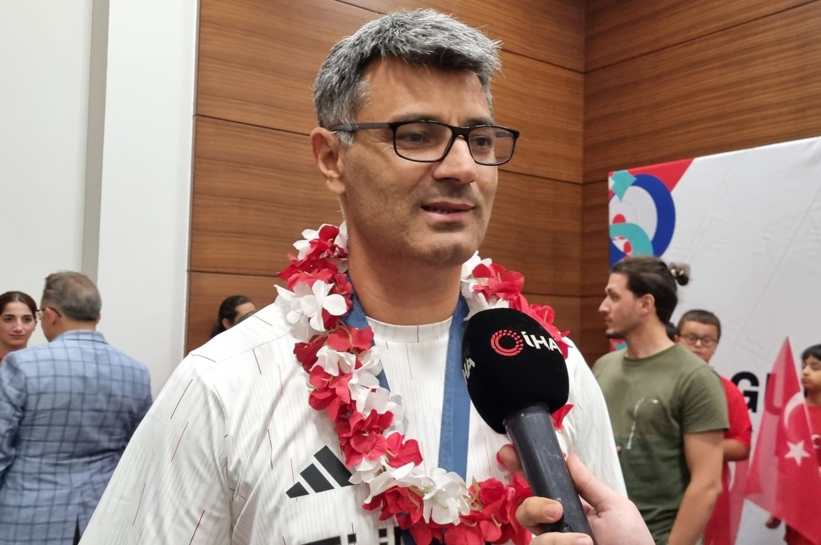 Turkish shooter Yusuf Dikeç talks to media on return from Paris Olympics, Istanbul, Türkiye, Aug. 1, 2024. (IHA Photo)