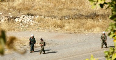 A group of PKK terrorists are seen in a region near the Iraqi-Turkish border, Oct. 27, 2007. (AP Photo)