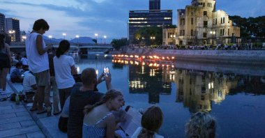 People light lanterns by the Motoyasu River in Hiroshima to mark the 79th anniversary of the first atomic bomb attack, Hiroshima, Japan, Aug. 5, 2024. (AFP Photo)