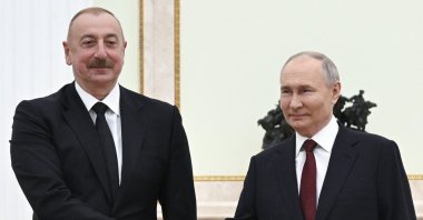 Russian President Vladimir Putin (R) and Azerbaijani President Ilham Aliyev pose for a photo during their meeting at the Kremlin, Moscow, Russia, April 22, 2024. (AP Photo)