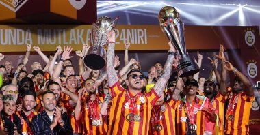 Galatasaray players celebrate with the Süper Lig trophy at Rams Park, Istanbul, Türkiye, May 27, 2024. (Getty Images Photo)
