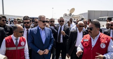 Foreign Minister Hakan Fidan (C) listens to Egypt's Red Crescent members during his visit to the Rafah border crossing with the Gaza Strip in Rafah, Egypt, Aug. 4, 2024. (EPA Photo)
