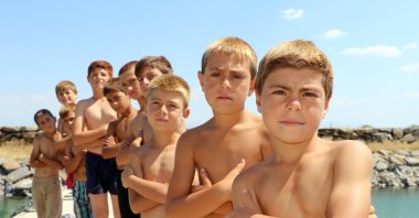 Children pose at the shore of Lake Van, Türkiye, Aug. 6, 2024. (DHA Photo)