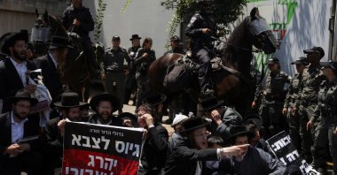 Ultra-Orthodox Jewish men gather during a demonstration after the Supreme Court ruled in June that the defense ministry could no longer grant blanket exemptions to Jewish seminary students from military conscription, at Tel HaShomer recruitment base, in Ramat Gan, Israel Aug. 5, 2024. (Reuters Photo)