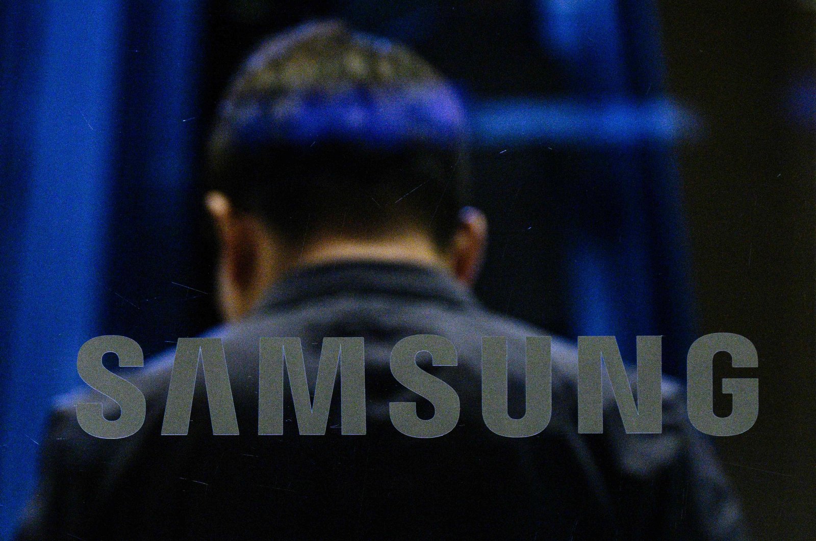 A man walks past a Samsung logo displayed at the company&#039;s Seocho building in Seoul, South Korea, July 31, 2024. (AFP Photo)