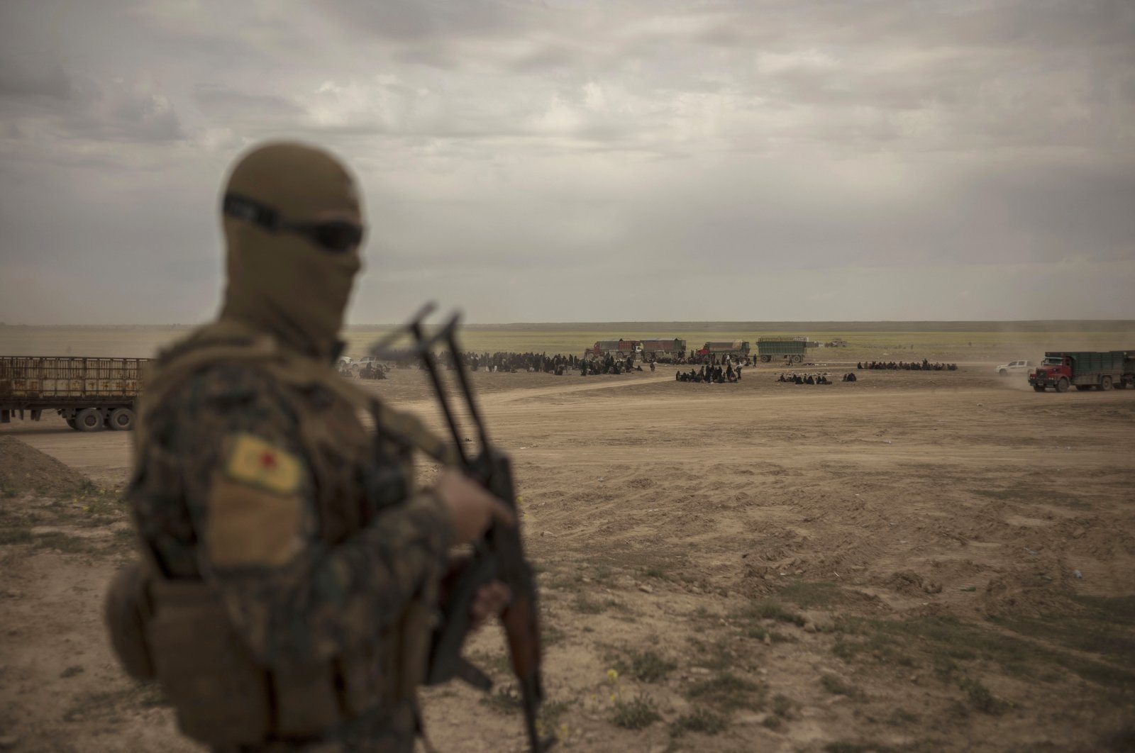 A PKK/YPG terrorist is spotted in Baghouz, Syria, March 6, 2019. (AP Photo)