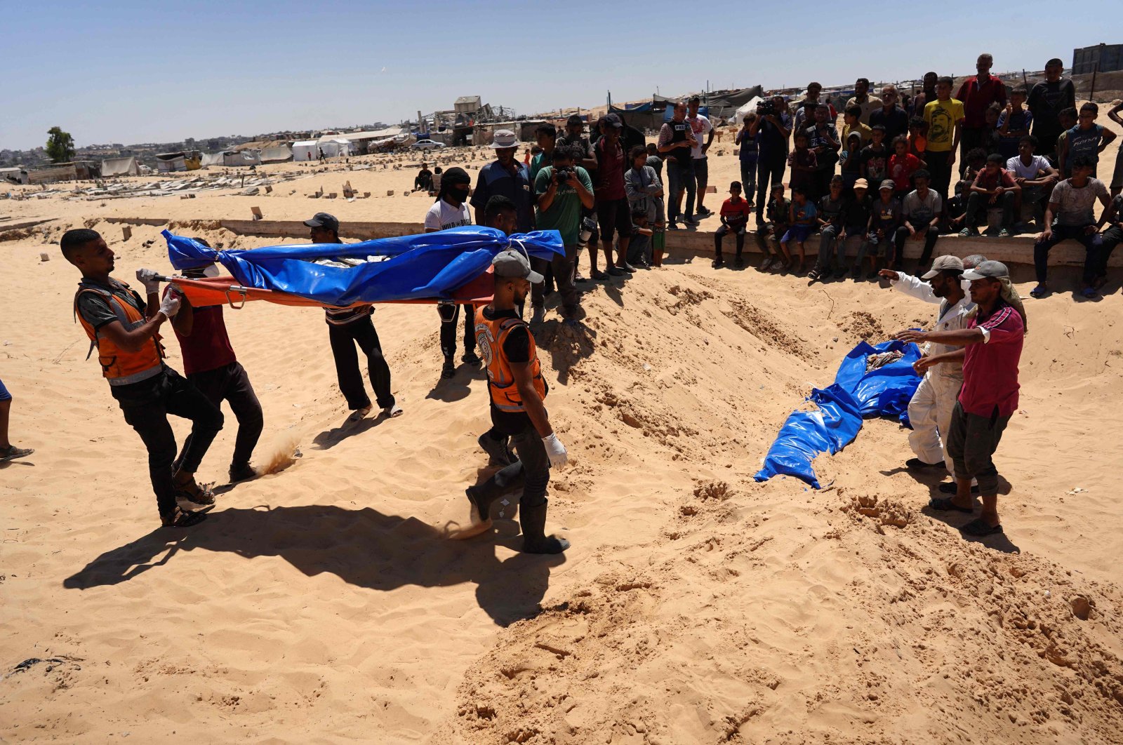 People bury bodies that were taken and later released by Israel during a mass funeral at a cemetery in Khan Younis, southern Gaza Strip, Palestine, Aug. 5, 2024. (AFP Photo)