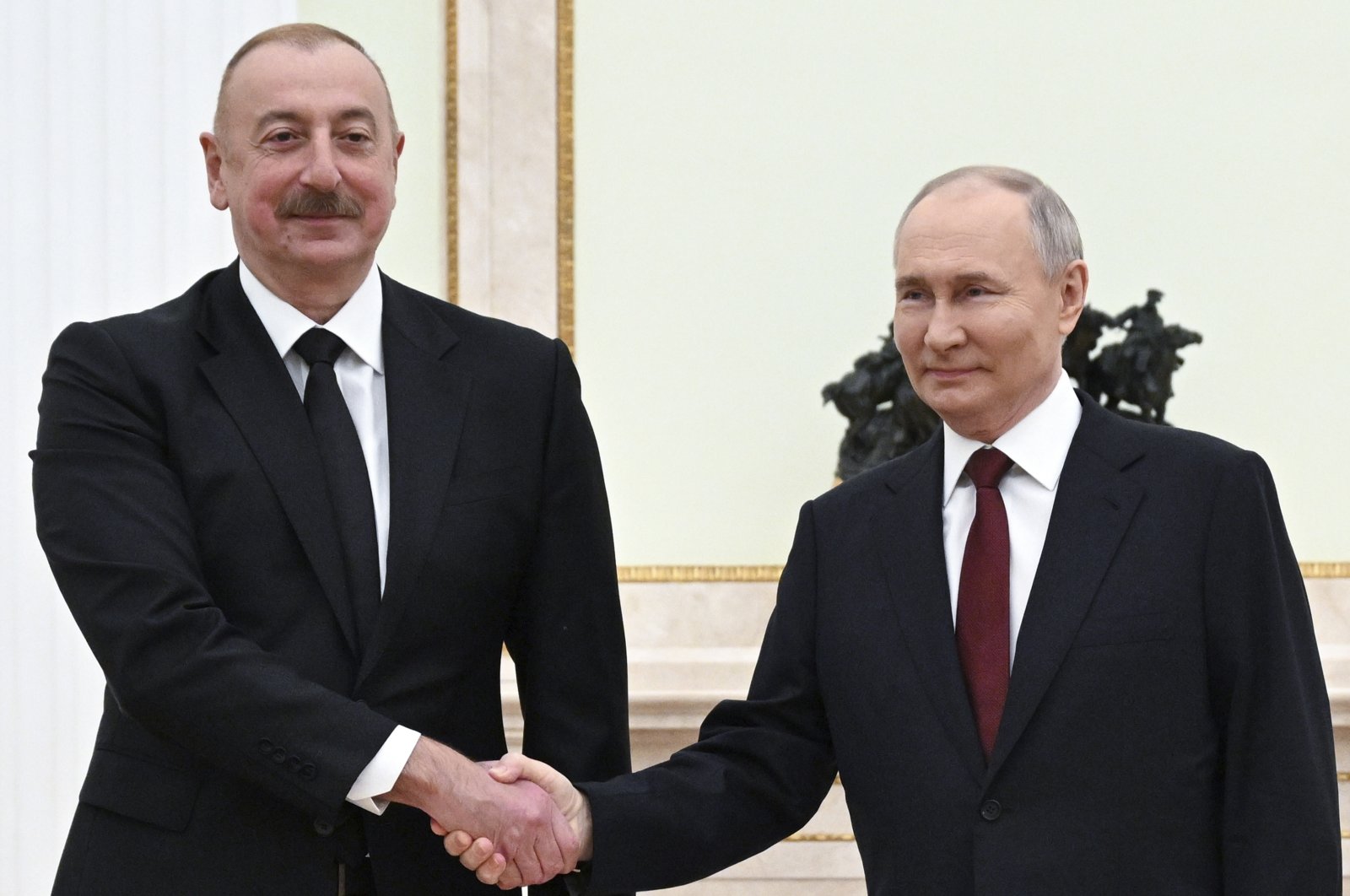 Russian President Vladimir Putin (R) and Azerbaijani President Ilham Aliyev pose for a photo during their meeting at the Kremlin, Moscow, Russia, April 22, 2024. (AP Photo)