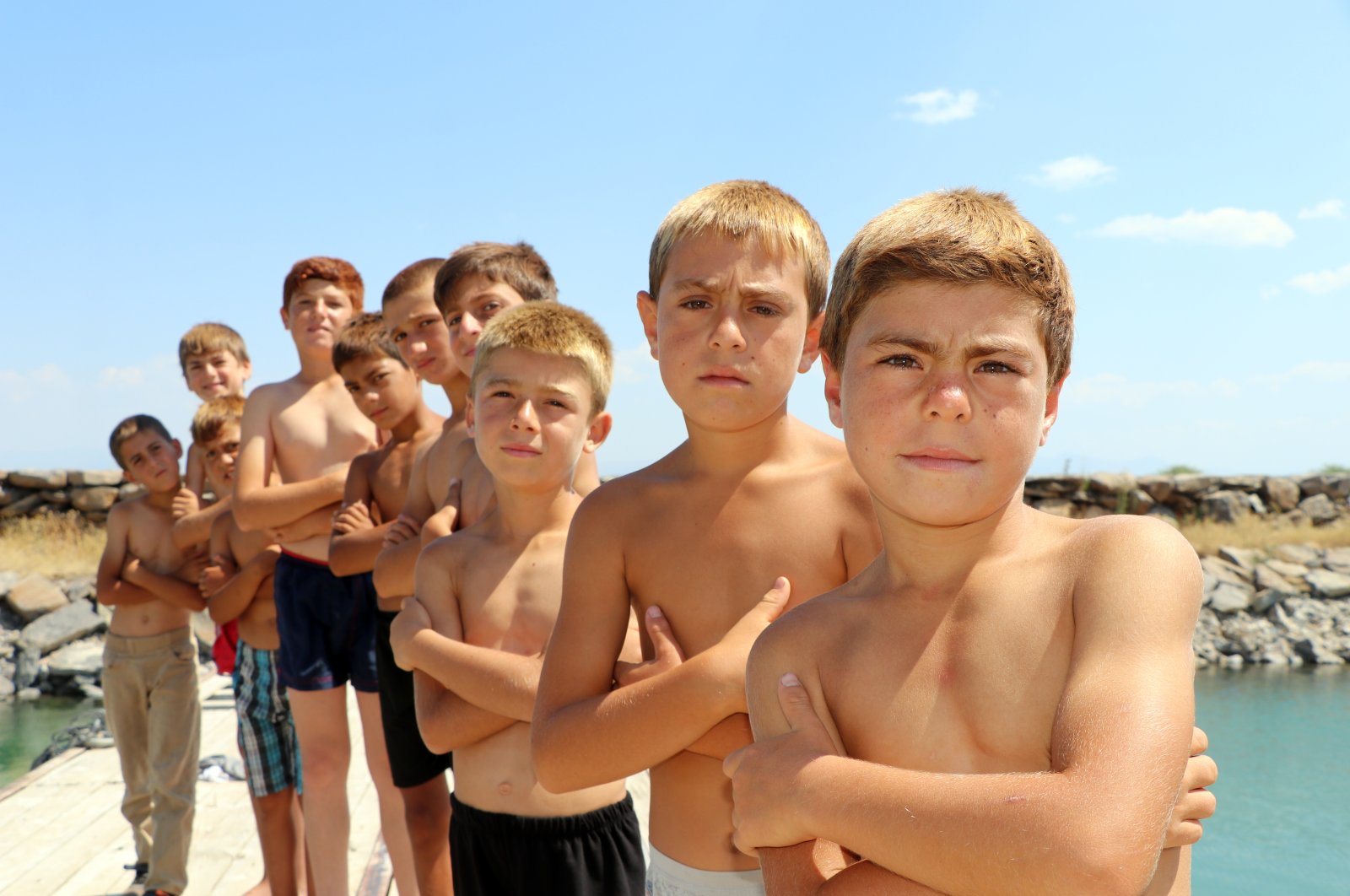 Children pose at the shore of Lake Van, Türkiye, Aug. 6, 2024. (DHA Photo)