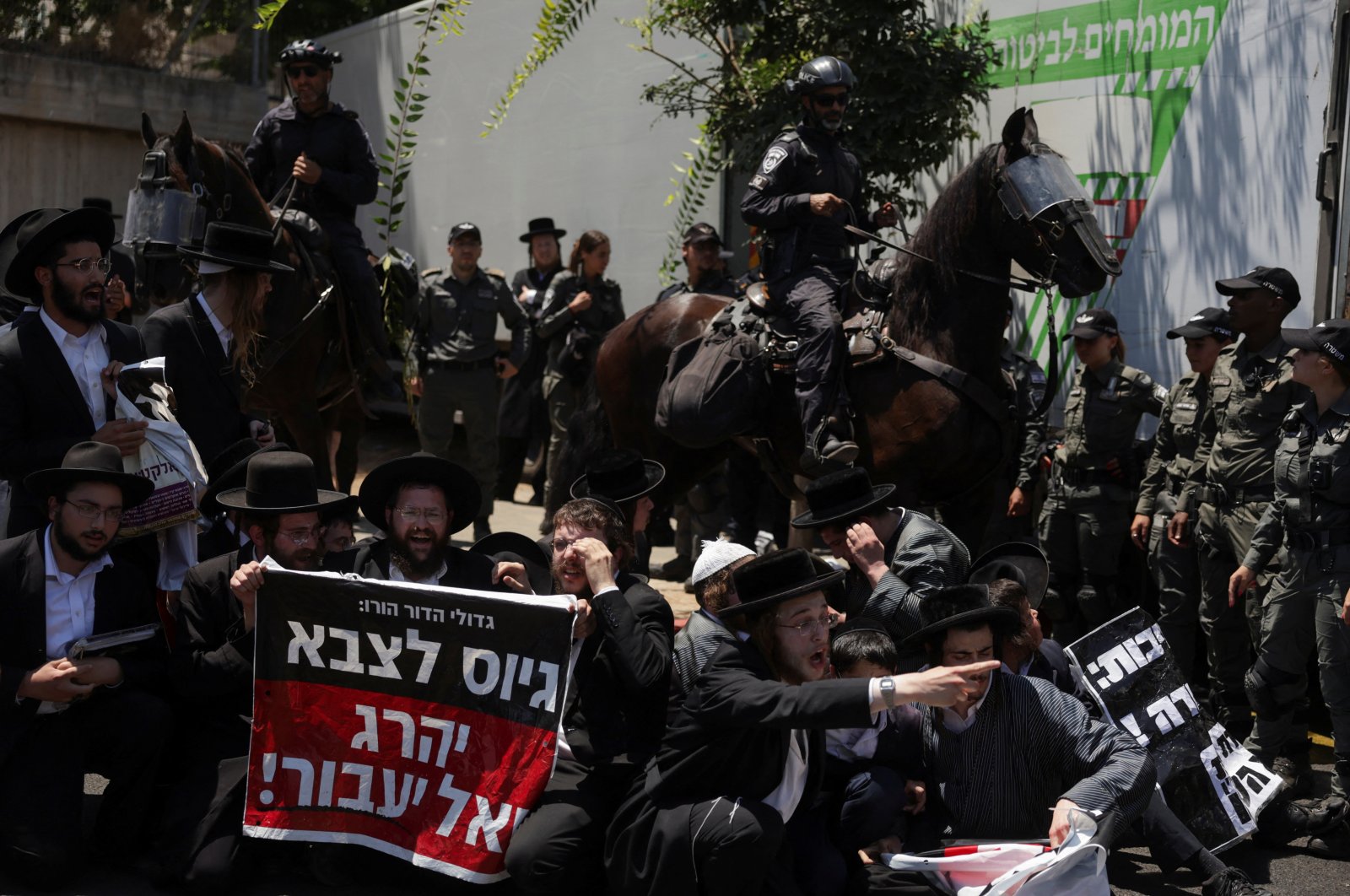 Ultra-Orthodox Jewish men gather during a demonstration after the Supreme Court ruled in June that the defense ministry could no longer grant blanket exemptions to Jewish seminary students from military conscription, at Tel HaShomer recruitment base, in Ramat Gan, Israel Aug. 5, 2024. (Reuters Photo)