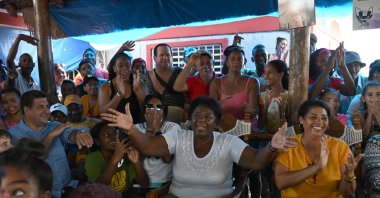 The mother of Cuban wrestler Mijain Lopez, Leonor Nunez (C), celebrates with friends and neighbours the victory of her son after he won the men's greco-roman 130 kg. wrestling event at the Paris 2024 Olympic Games, at her home in the town of Herradura, Pinar del Rio province, Cuba, Aug. 6, 2024. (AFP Photo)