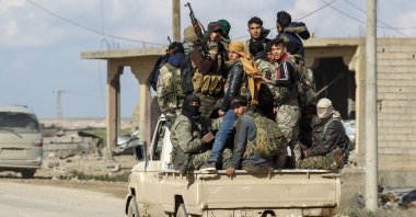 Members of the PKK/YPG patrol through a village in Deir el-Zour, Syria, Feb. 18, 2019. (Getty Images)
