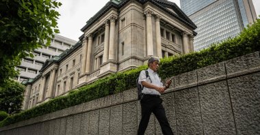 A man walks past the Bank of Japan (BoJ) headquarters complex in central Tokyo, Japan, June 13, 2024. (AFP Photo)