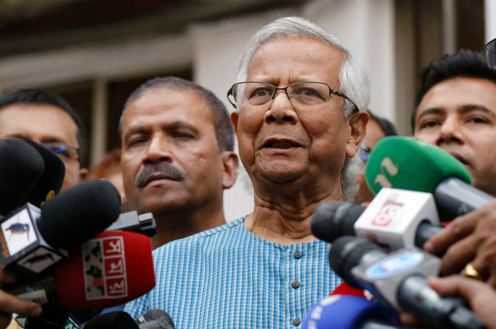 Bangladeshi Nobel laureate Muhammad Yunus (2nd R) addresses the media in Dhaka, Bangladesh, March 3, 2024. (AFP Photo)