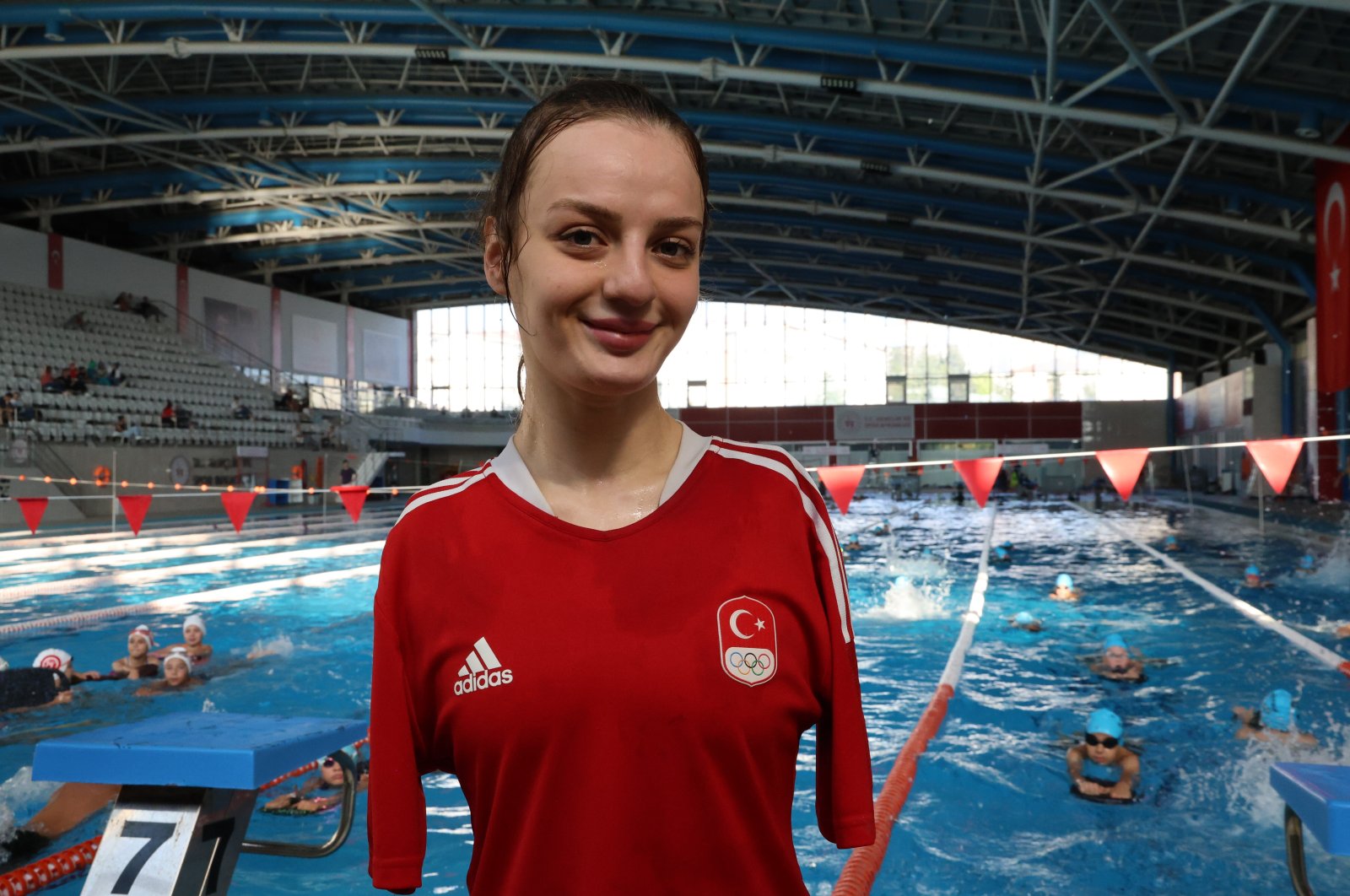 Turkish swimmer Sümeyye Boyacı poses for a photo at the Yenikent Olympic Swimming Pool, Eskişehir, Türkiye, Aug. 7, 2024. (IHA Photo)