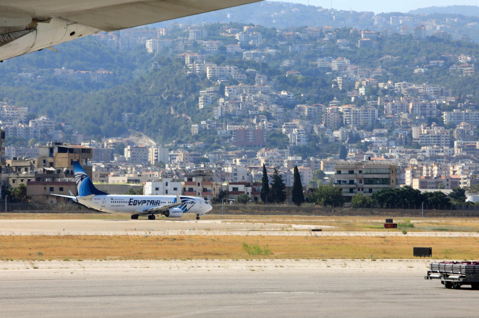 An Egypt air plane is pictured on the tarmac at Beirut International airport on August 5, 2024. Urgent calls grew for foreign nationals to leave Lebanon, which would be on the front line of a regional war, as Iran and its allies readied their response to high-profile killings blamed on Israel. (Photo by AFP)