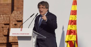 Carles Puigdemont addresses thousands gathered near the Catalan regional parliament, in Barcelona, Spain, 