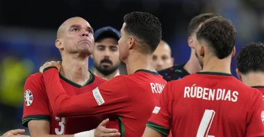Portugal&#039;s Cristiano Ronaldo (2nd Left) embraces Pepe at the end of a quarterfinal match against France at the Euro 2024 football tournament in Hamburg, Germany, July 5, 2024. (AP Photo)