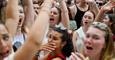 Fans of the singer Taylor Swift gather following the cancelation of three Taylor Swift concerts at Happel stadium after the government confirmed a planned attack at the venue, in Vienna, Austria, Aug. 8, 2024. (Reuters Photo)