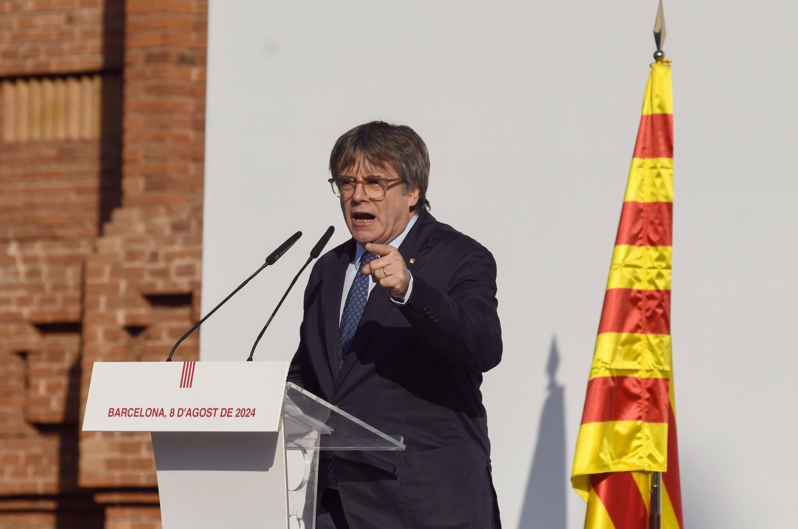 Carles Puigdemont addresses thousands gathered near the Catalan regional parliament, in Barcelona, Spain, 