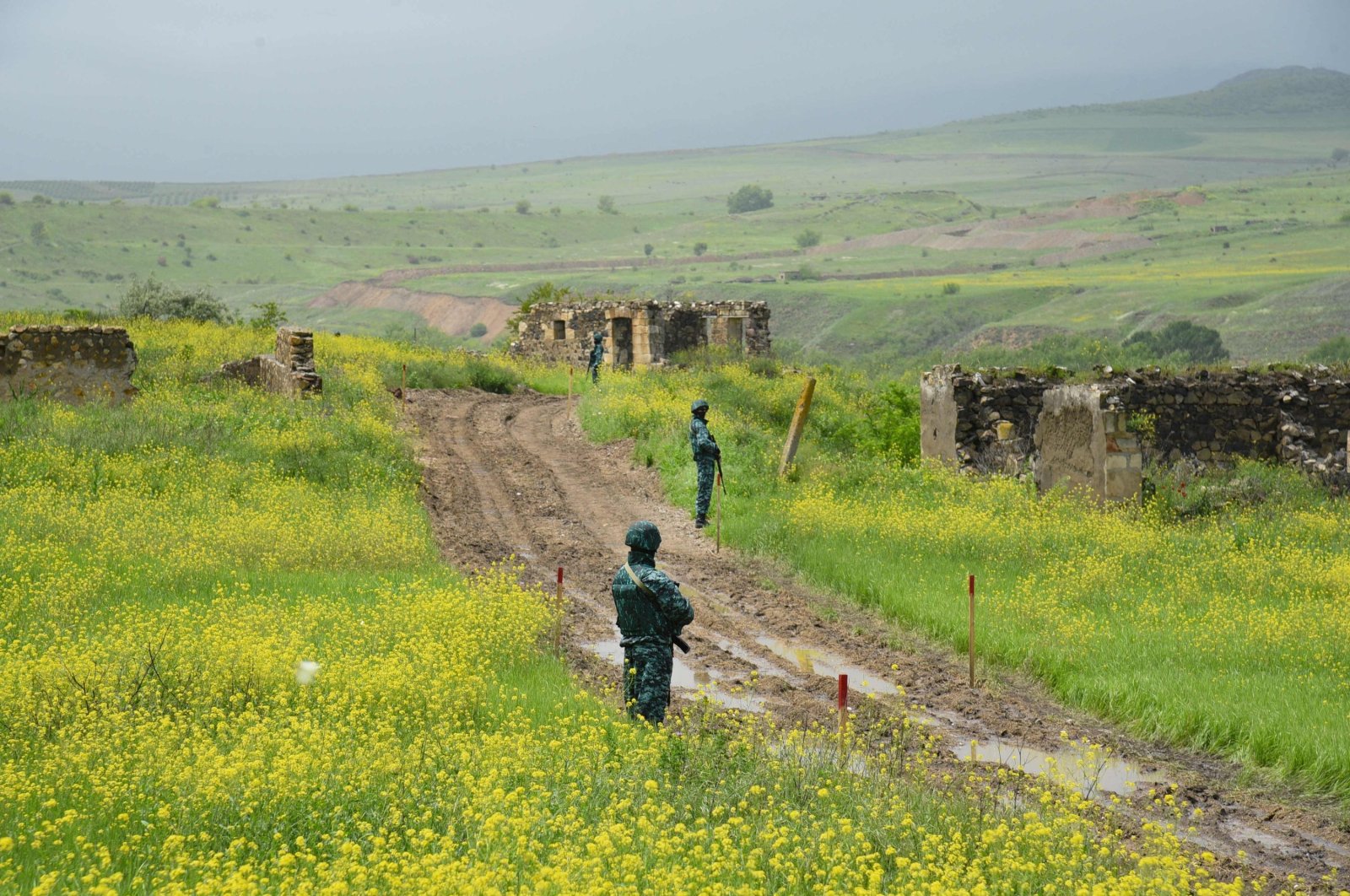 Azerbaijani border guards are seen in Ghizilhajili, one of the four villages Armenia recently returned to Azerbaijani control under a border demarcation deal between the Caucasus rivals, the Karabakh region, Azerbaijan, May 28, 2024. (AFP Photo)