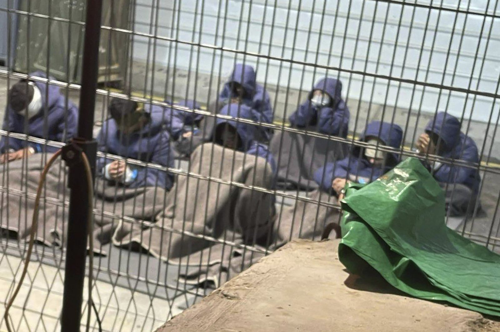 This undated photo from Winter 2023 provided by Breaking The Silence shows Palestinian prisoners at a detention facility on the Sde Teiman military base in southern Israel. (Breaking The Silence via AP)