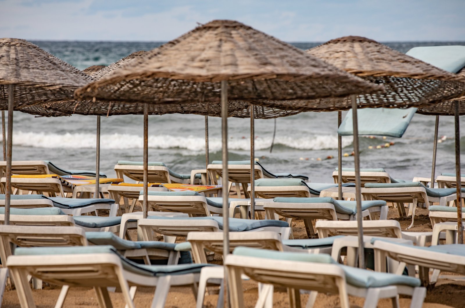 Empty beach beds under parasols in Baia Beach in Şile, Istanbul, Sept. 20, 2022. (Getty Images File Photo)