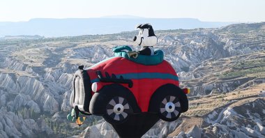 A hot air balloon soars over the skies of Cappadocia during the Nevşehir Cultural Route Festival, Nevşehir, central Türkiye, Aug. 8, 2024. (AA Photo)