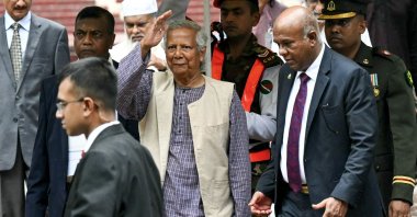 Nobel laureate and chief adviser of Bangladesh&#039;s new interim government, Muhammad Yunus (C) greets the public after laying a wreath at the National Martyrs&#039; Memorial, Dhaka, Bangladesh, Aug. 9, 2024. (AFP Photo)