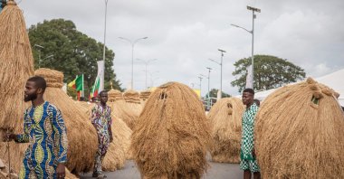 Zangbeto masks parade during the grand procession of traditional masks, Porto-Novo, Benin, Aug. 4, 2024.