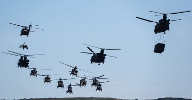 An attack helicopter conducts targets practice during military exercise Efes-2024 in western Izmir province, Türkiye, May 30, 2024. (AA Photo)