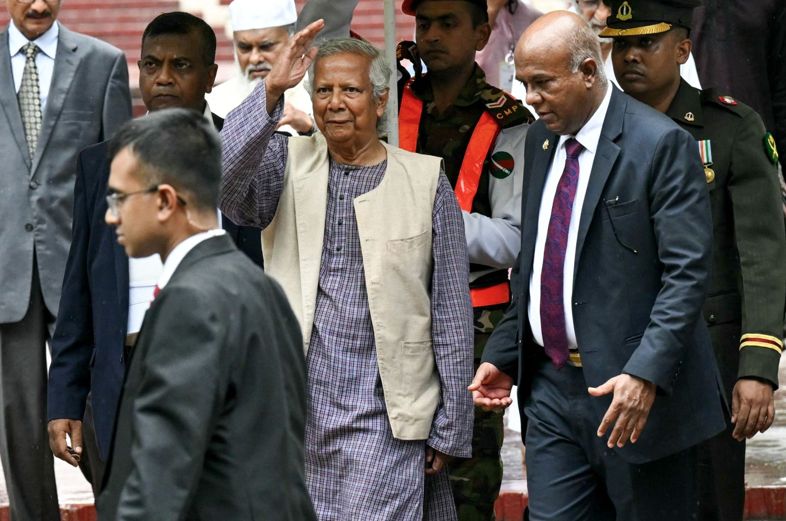 Nobel laureate and chief adviser of Bangladesh&#039;s new interim government, Muhammad Yunus (C) greets the public after laying a wreath at the National Martyrs&#039; Memorial, Dhaka, Bangladesh, Aug. 9, 2024. (AFP Photo)