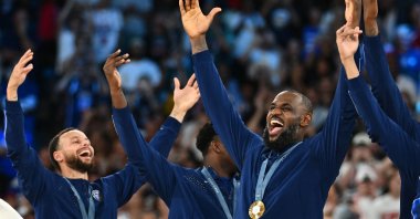 Gold medallists USA's Stephen Curry (L) and LeBron James celebrate beating France, in Paris, France, Aug. 10, 2024. (AFP Photo)