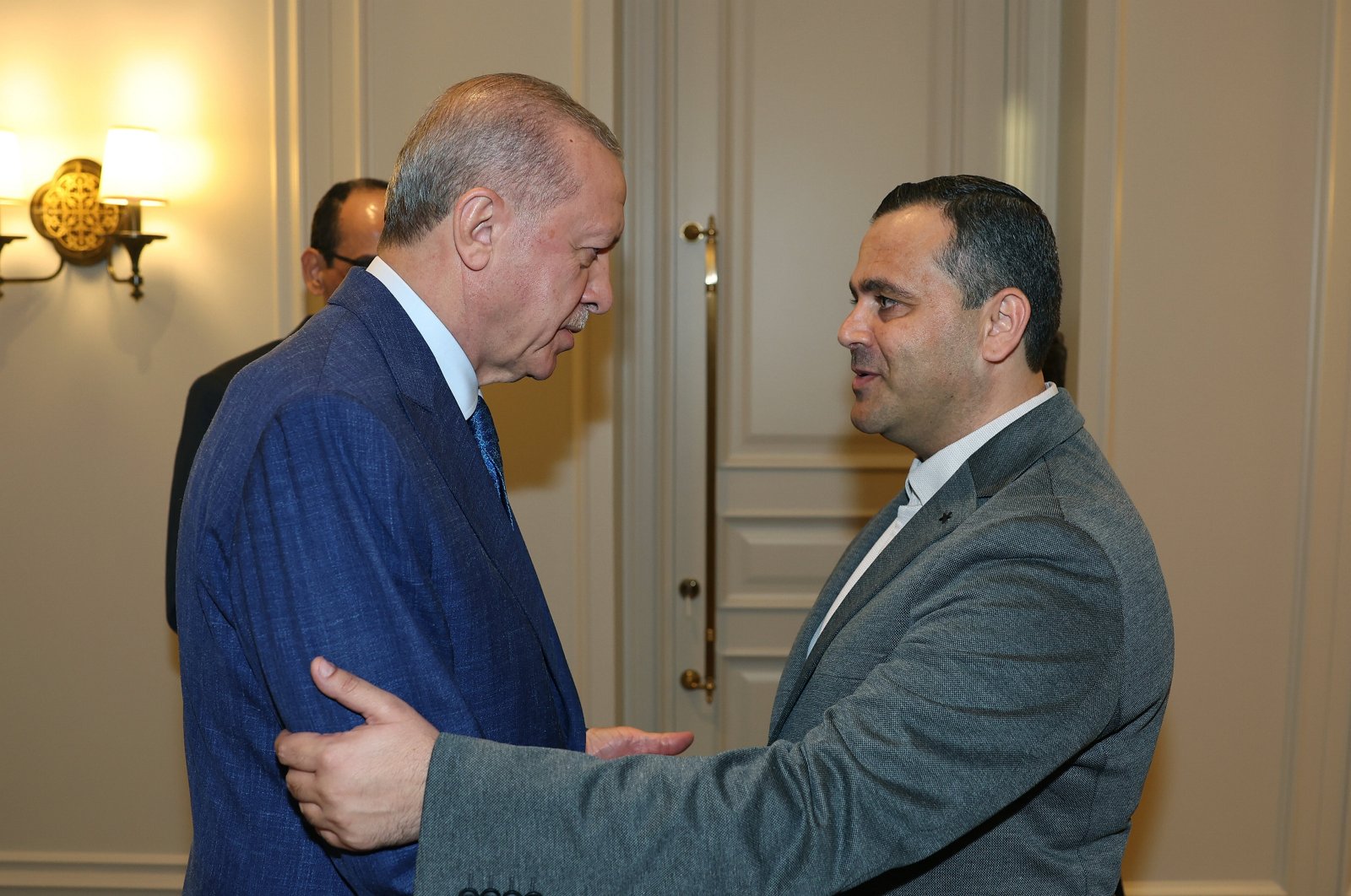 President Recep Tayyip Erdoğan hugs Hammam Haniyeh (R) before their meeting, Istanbul, Türkiye, Aug. 10, 2024. (AA Photo)