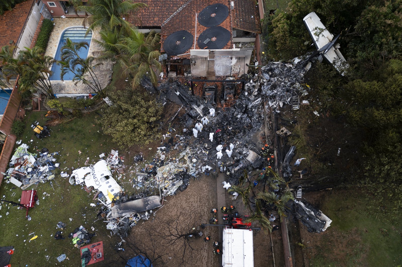 An aerial view shows Brazilian forensics working at the crash site in Vinhedo, Brazil, Aug. 10, 2024. (EPA Photo)