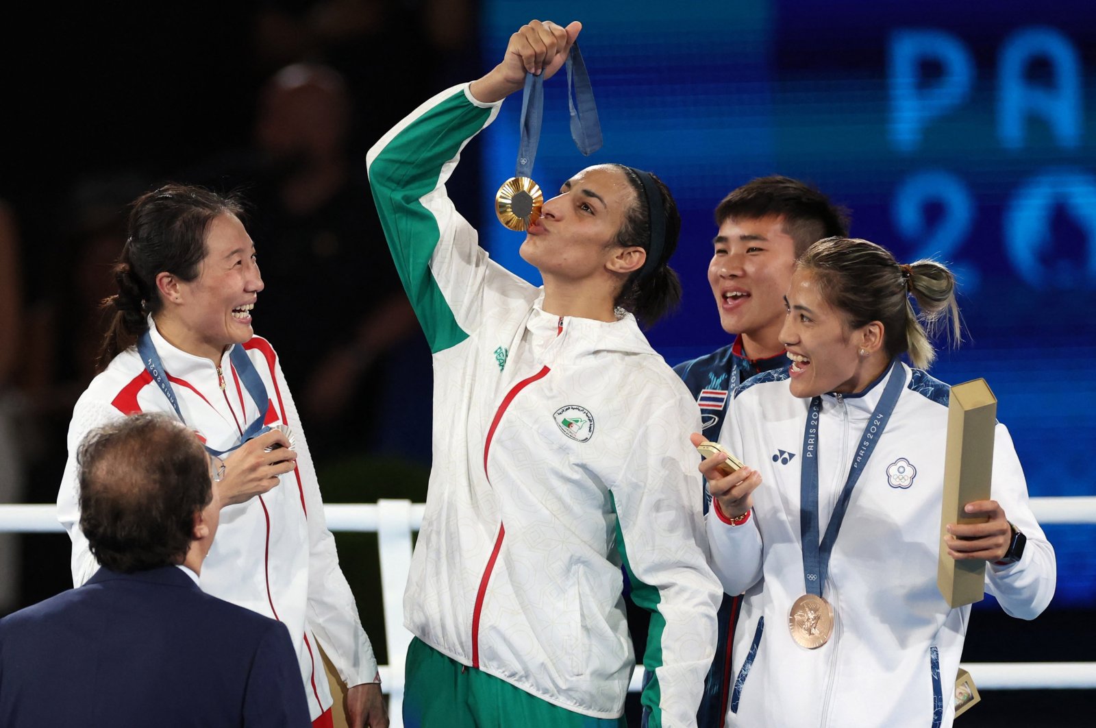 Gold medallist Imane Khelif of Algeria kisses her medal as silver medallist Liu Yang of China, bronze medallists Nien Chin Chen of Taiwan and Janjaem Suwannapheng of Thailand react, Paris, France, Aug. 09, 2024. (Reuters Photo)