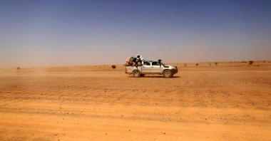 Indigenous Sahrawi people sit on a pick-up truck as they drive toward Tifariti, Western Sahara, Sept. 8, 2016. (Reuters Photo)