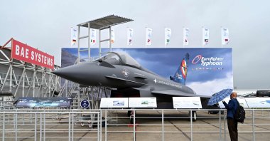 A person looks at a Eurofighter Typhoon on the opening day of the Farnborough International Airshow 2024, southwest of London, U.K., July 22, 2024. (AFP Photo)
