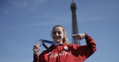 Women&#039;s 50 kg. boxing silver medallist Buse Naz Cakıroğlu of Türkiye poses during the Champions Park medallists celebrations in front of the Eiffel Tower, Paris, France, Aug. 10, 2024. (Reuters Photo)