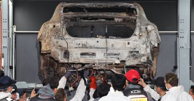 Officials from police, fire, National Forensic Service and Mercedes-Benz conducted a second joint forensic examination of an electric car that caught fire in the underground parking lot of an apartment complex on Aug. 1, Incheon, South Korea, Aug. 8, 2024. (Reuters Photo)