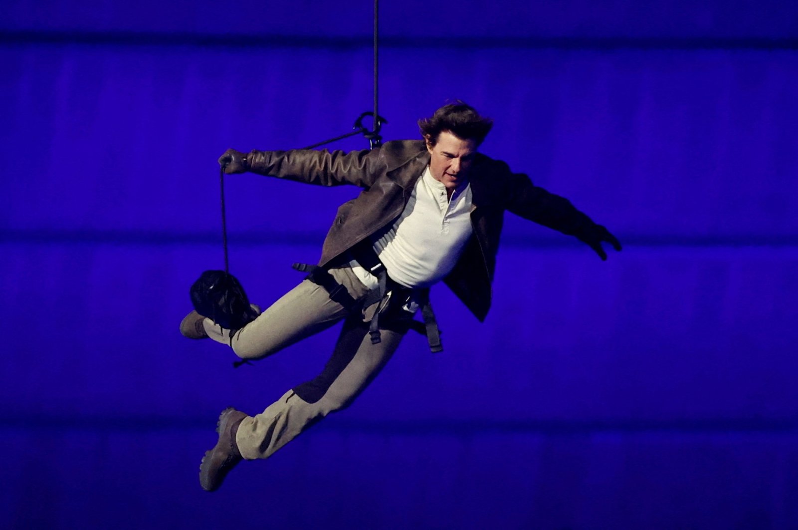 Actor Tom Cruise jumps from the roof of the Stade de France during the closing ceremony of the Paris 2024 Olympics, Saint-Denis, France, Aug. 11, 2024. (Reuters Photo)