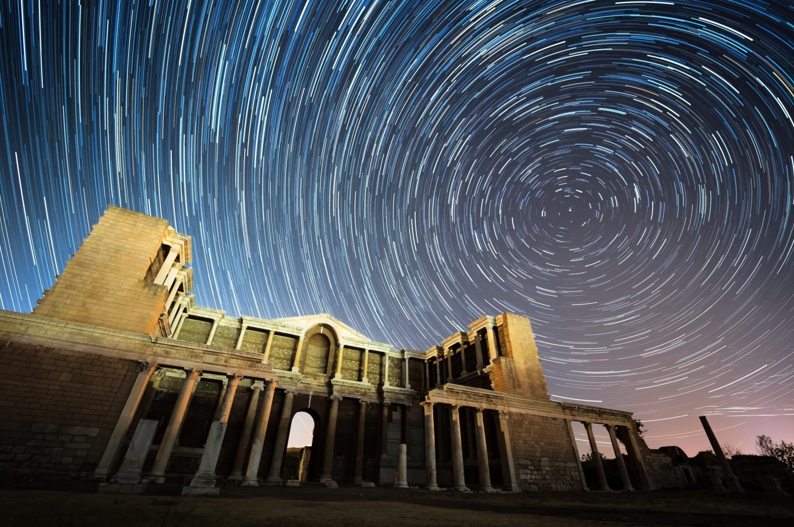 A Perseid meteor shower at the Sardes Ancient City in Manisa, Türkiye, Aug. 11, 2024. (IHA Photo)