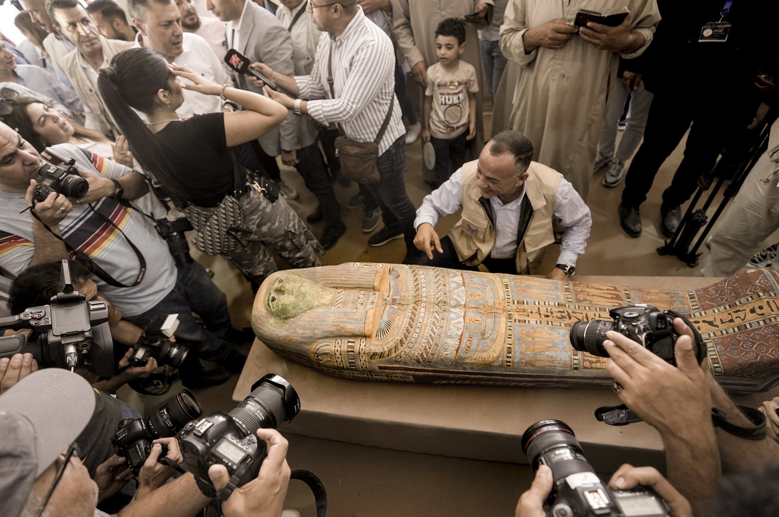 Mostafa Waziri, secretary-general of the Supreme Council of Antiquities, displays a recently unearthed ancient wooden sarcophagus at the site of the Step Pyramid of Djoser in Saqqara, 24 kilometers (15 miles) southwest of Cairo, Egypt, Saturday, May 27, 2023. (AP File Photo)