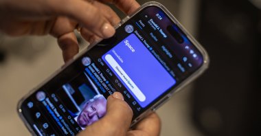 A person tries to access the social media platform &#039;X&#039; to listen to U.S. Former President Donald J. Trump&#039;s interview with Elon Musk, Miami, Florida, U.S., Aug. 12, 2024. (EPA Photo)