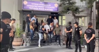 Police escort A.K. to the police station after detaining him in Eskişehir on Aug. 12, 2024. (DHA Photo)